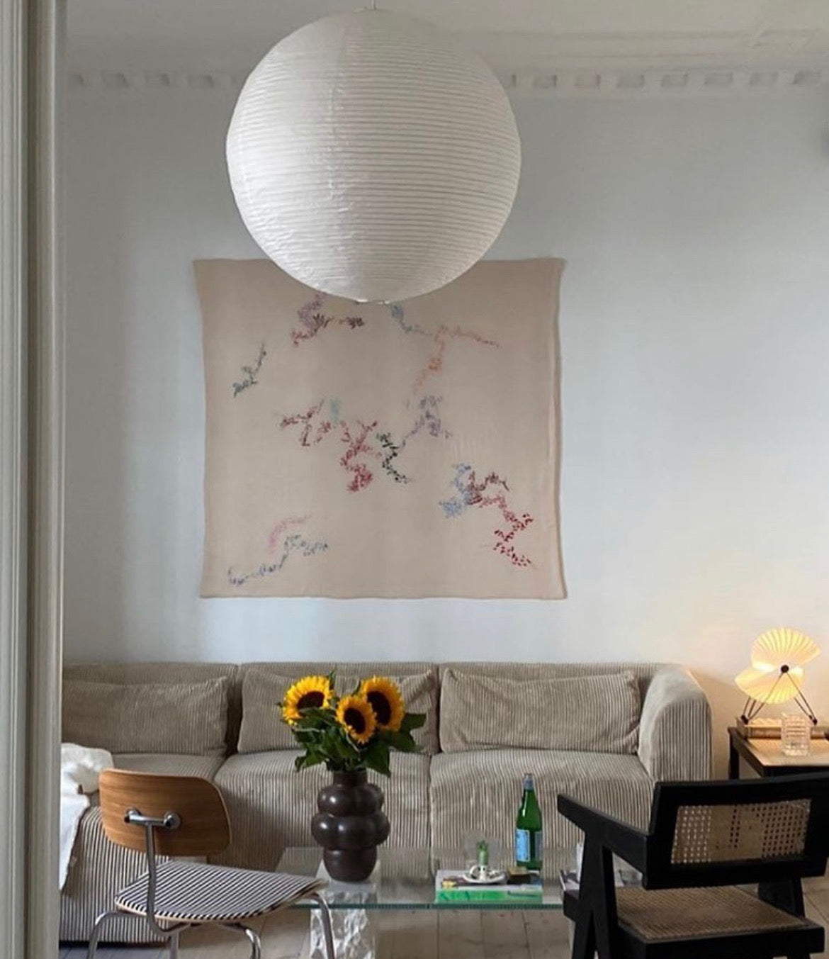 Betty - Handcrafted Wall Hanging, fully hand embroidered 130x130 cm, displayed on a living room wall.
