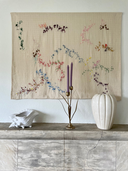 Elise Handcrafted Wall Hanging, hand embroidered 120x100 cm, displayed on a wall above a fireplace