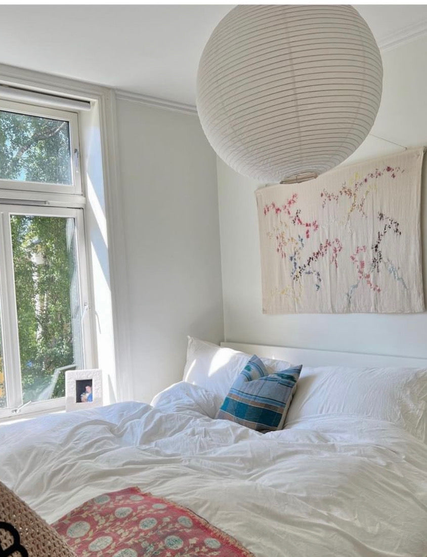 Ella - Handcrafted wall hanging 120x100 cm , fully hand embroidered. Displayed on a bedroom wall.