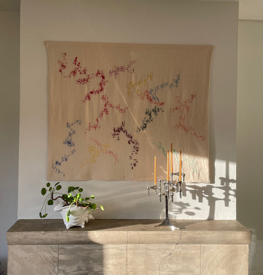 Indie - Handcrafted Wall Hanging, hand embroidered 120x100 cm displayed on a wall above a fireplace