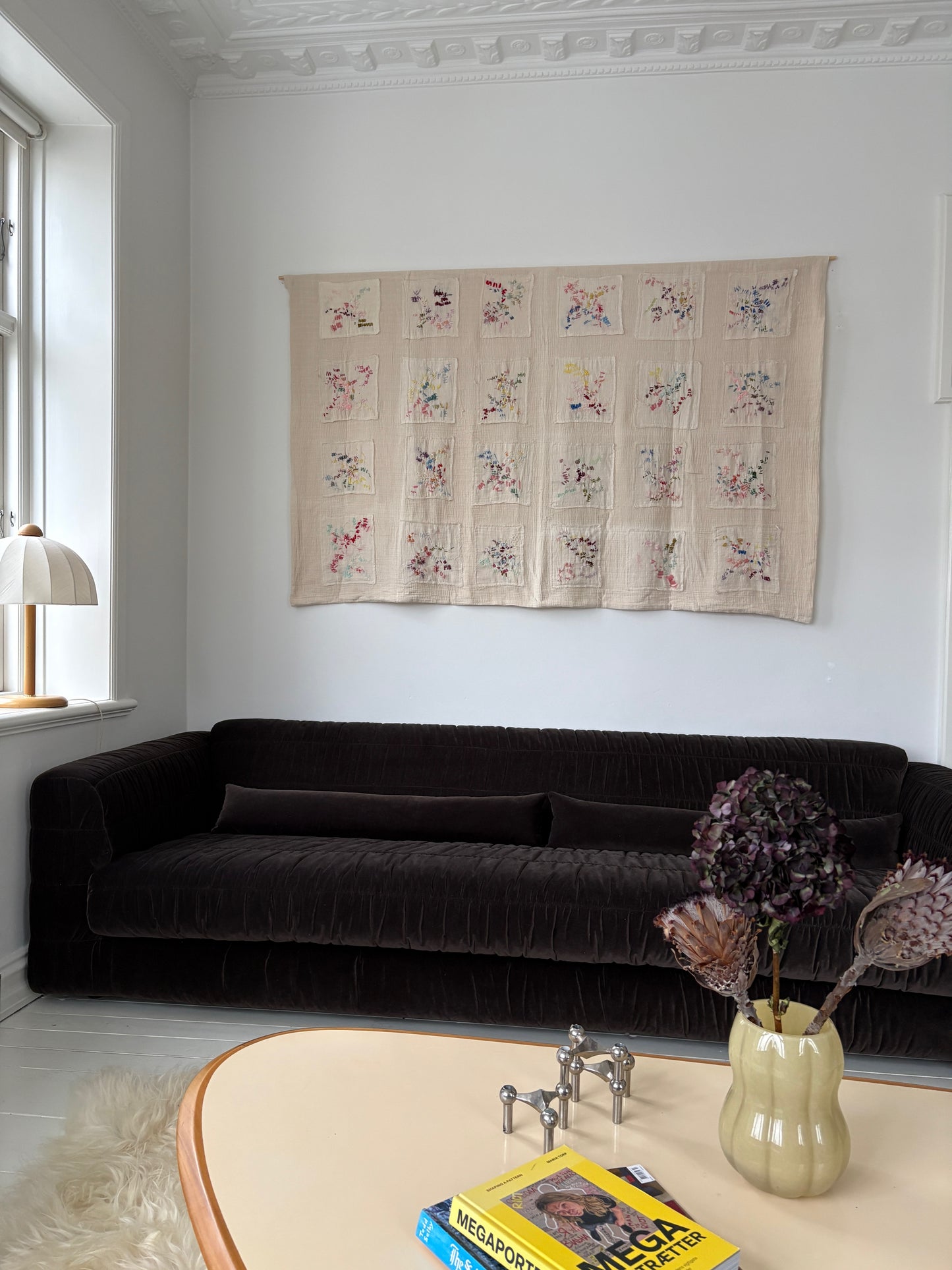 Ingrid - Handcrafted wall Hanging, fully hand embroidered 200x130 cm, displayed on a living room wall above a sofa