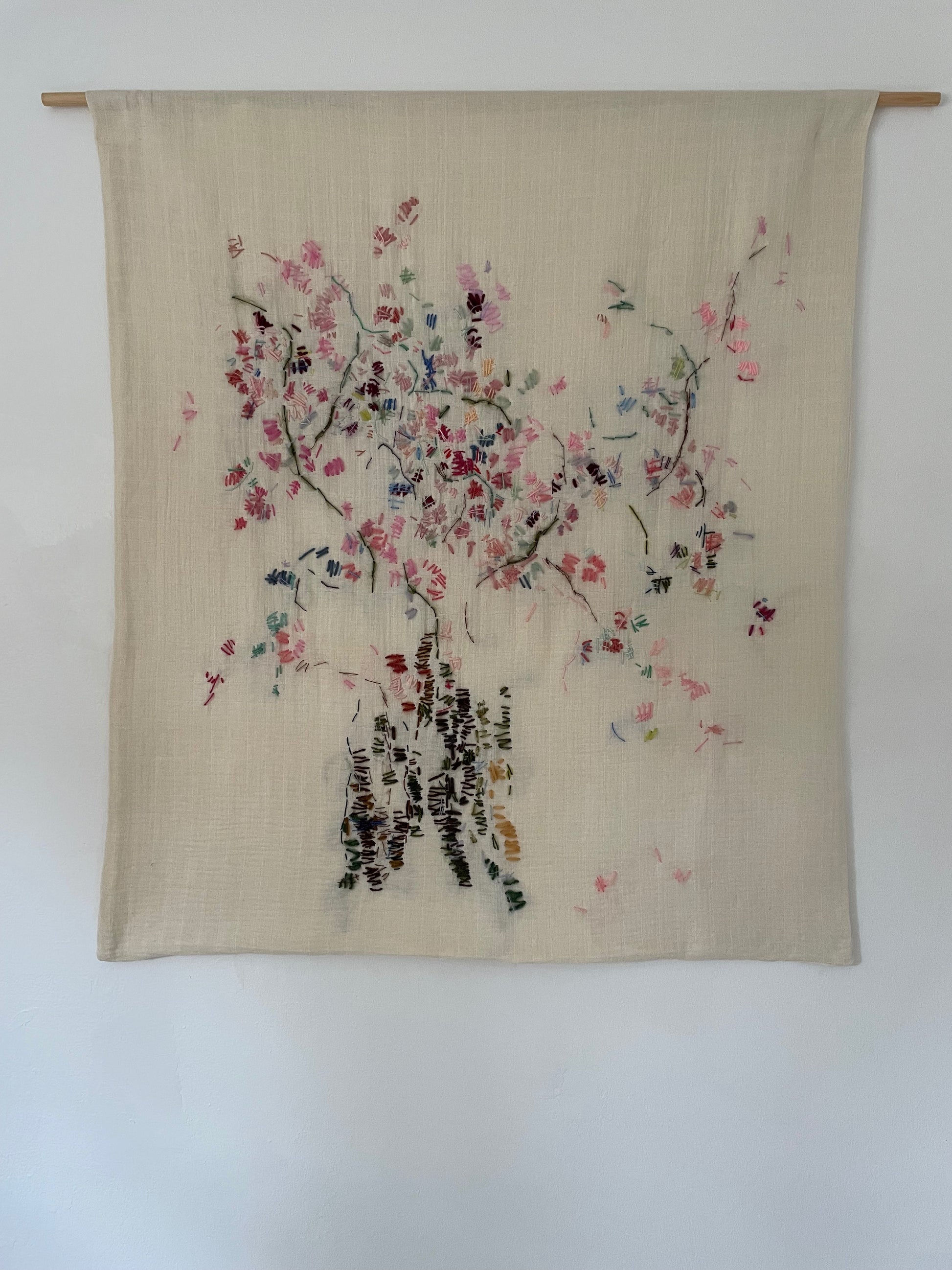 Liva - Handcrafted Wall Hanging, fully hand embroidered 65x95 cm displayed on a white wall.