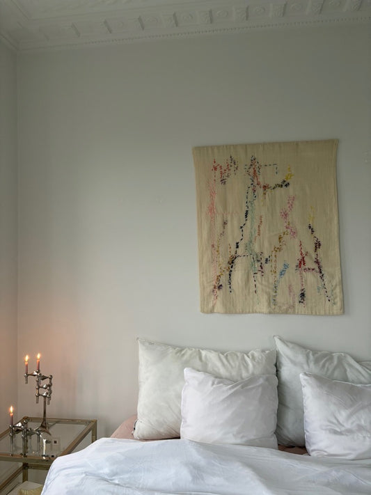 Handcrafted  Savanah Wall Hanging, fully hand embroidered 90x110 cm, displayed on a bedroom wall.