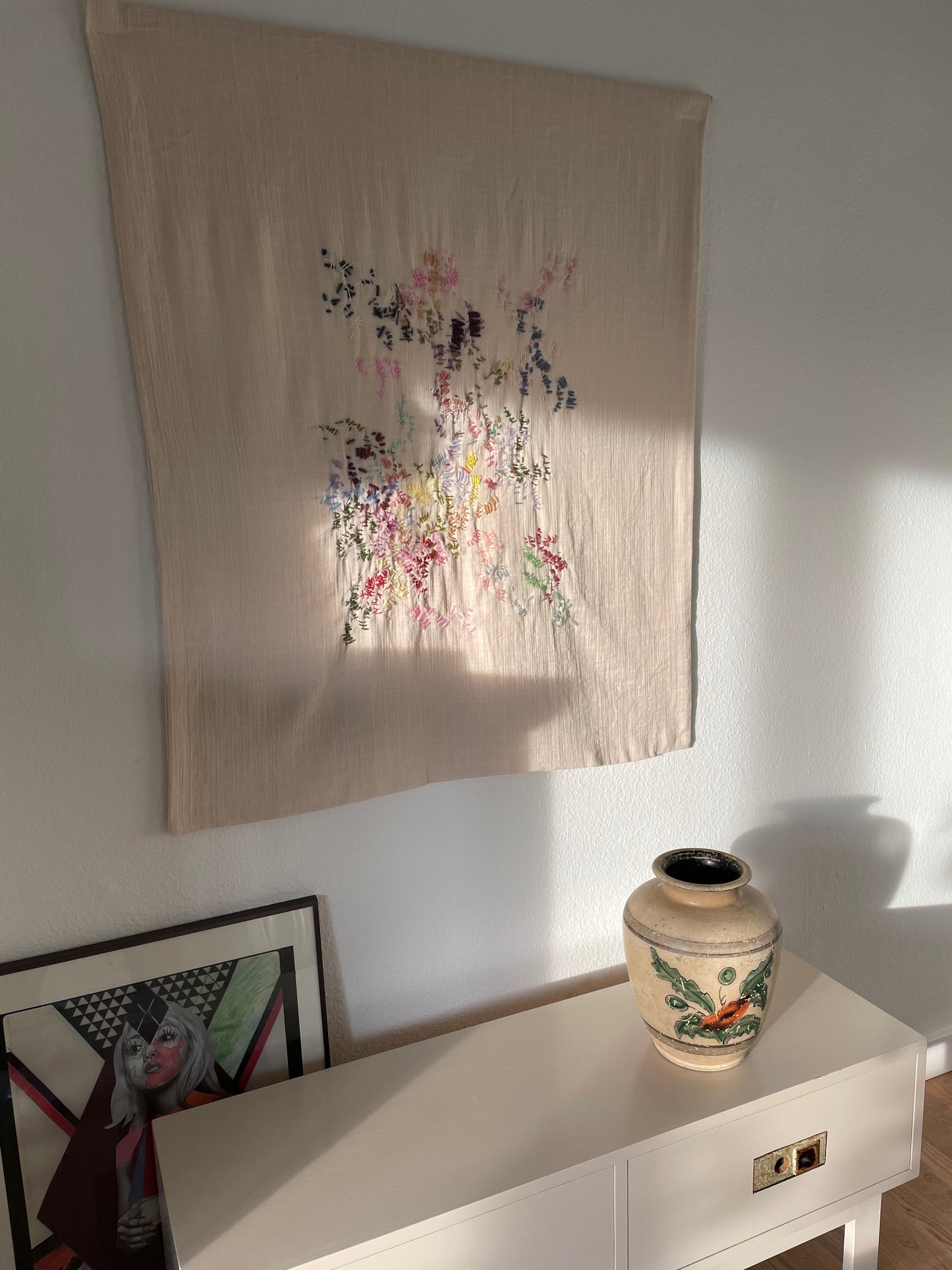 Smilla - Handcrafted Wall Hanging 90x100 cm,fully hand embroidered, displayed on a living room wall.
